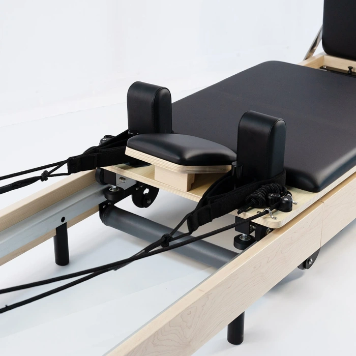 Sistema de Raíles y Ruedas del Reformer de Pilates.webp